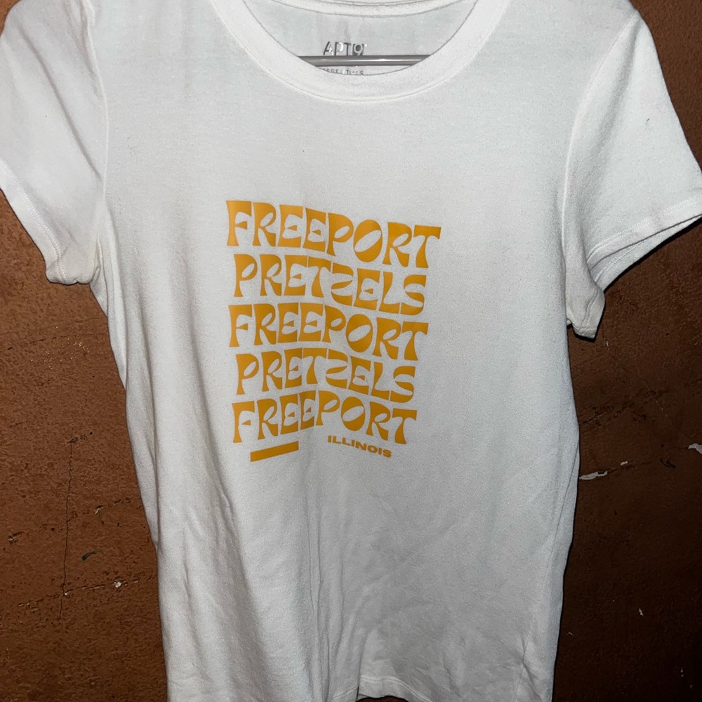 White T-Shirt with Orange Freeport Pretzels Graphic